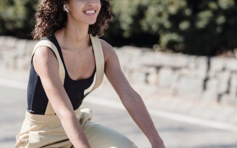 a woman riding a bicycle in the community