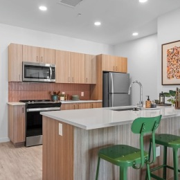 a kitchen with wood cabinets