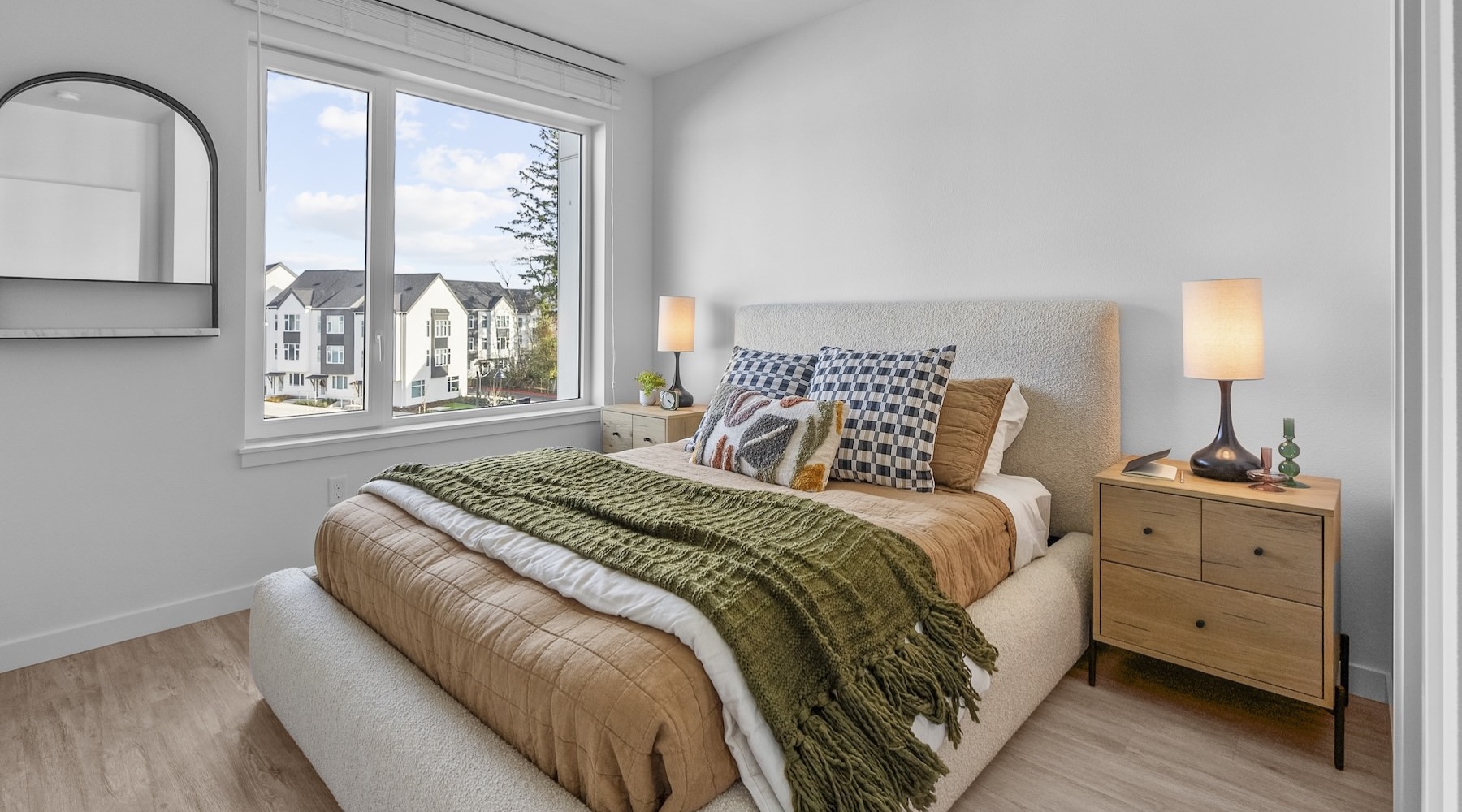 a bedroom with a bed and two nightstands