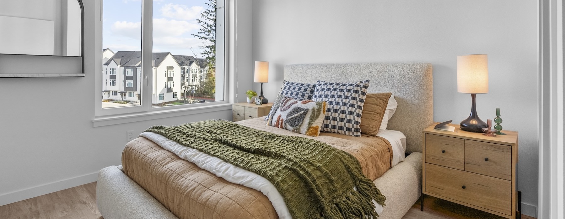 a bedroom with a bed and two nightstands
