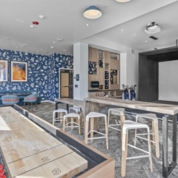 a game room with tables and chairs