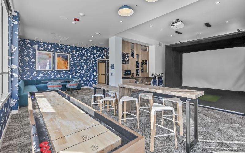 a game room with tables and chairs